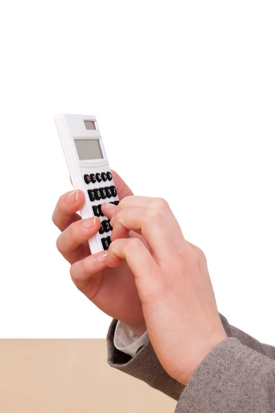 Mão feminina mantém uma calculadora na mão — Fotografia de Stock