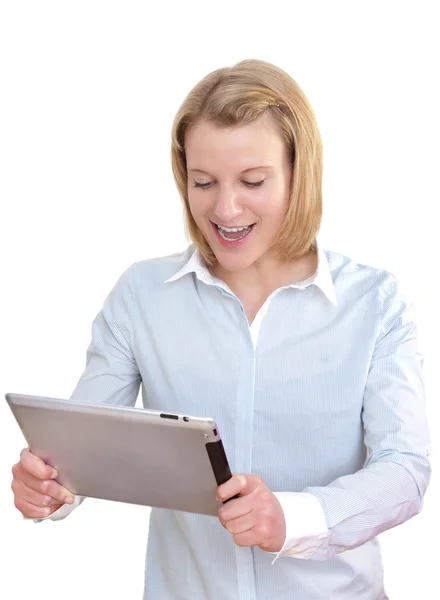 Beautiful young business woman looks astonished and surprised at her tablet pc — Stock Photo, Image