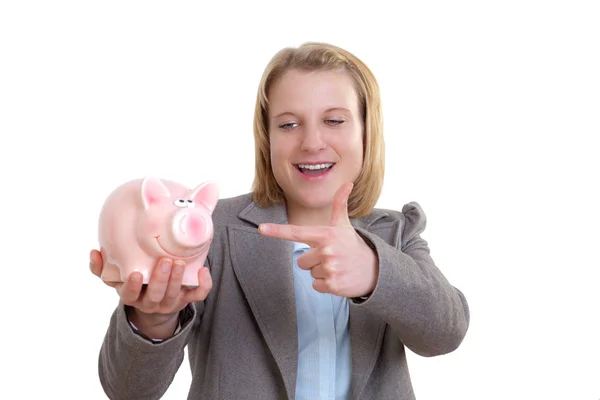 Young woman showing a piggy bank with her finger — Stock Photo, Image