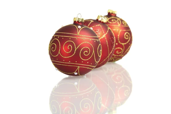 Three red big christmas balls mirrored on white background — Stock Photo, Image