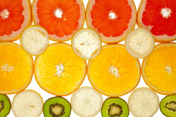 Bakgrund av kiwi, grapefrukt, apelsin och citron skivor — Stockfoto