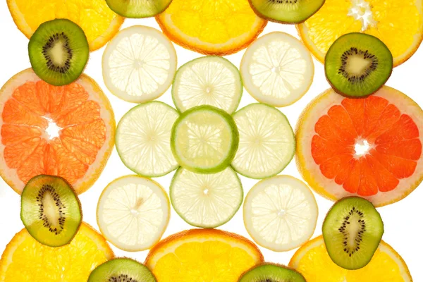 stock image Colorful background of different fruit slices