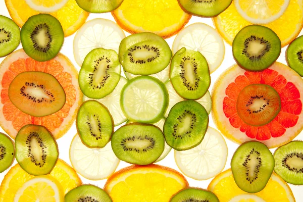 stock image Colorful background of different fruit slices