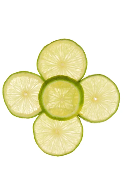 Five slices of lime as a pattern on a white background — Stockfoto