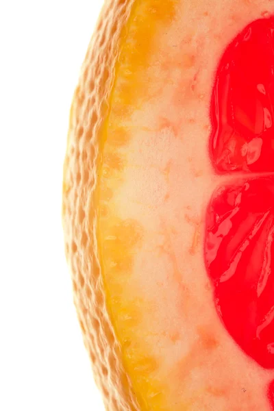 Macro shot of a quarter slice of grapefruit on white background — Stok fotoğraf