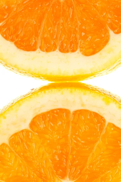 Macro shot of two quarter slice of orange in transmitted light — Stock Photo, Image