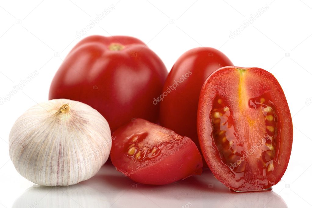 Fresh tomatoes with garlic onion on a white background