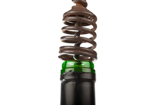 Old metal corkscrew in a wine cork — Stock Photo, Image