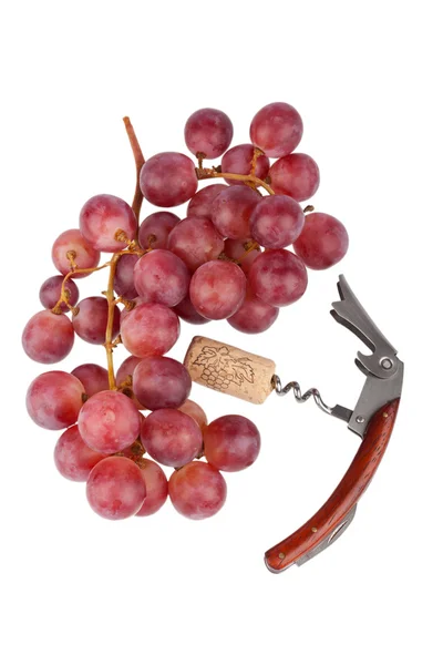 Kırmızı üzüm ve bir tirbuşon beyaz zemin üzerine — Stok fotoğraf