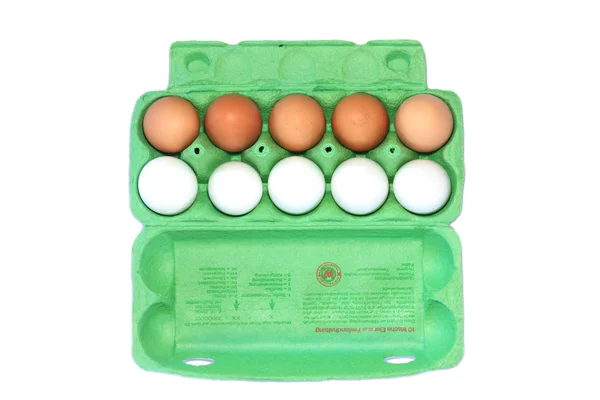 Brown and white eggs in a carton — Stock Photo, Image
