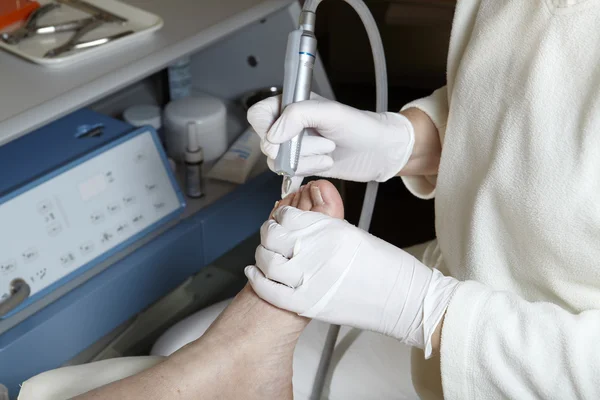 Foot Care in process with professional equipment — Stock Photo, Image