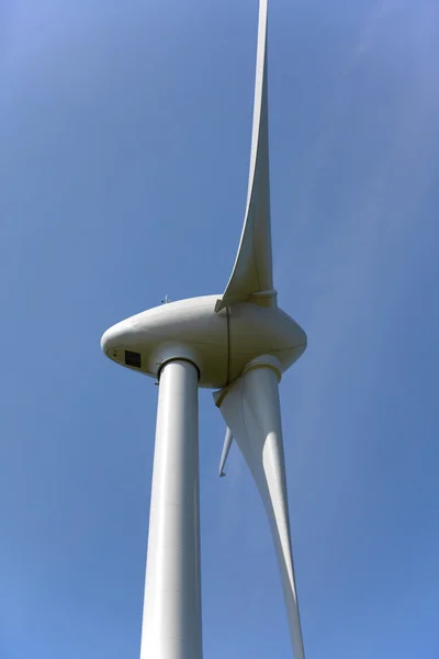 stock image Close up of a wind power wheel on a blue sky