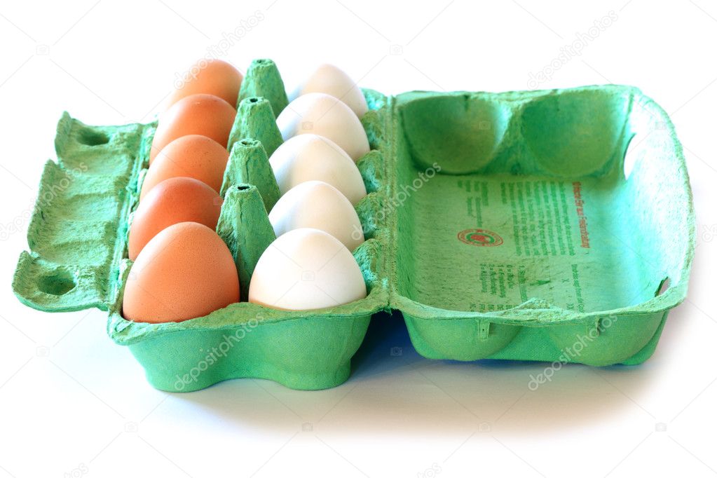 Brown and white eggs in a carton