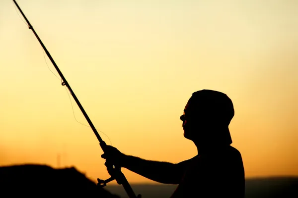 夕暮れの漁師 ロイヤリティフリーのストック画像