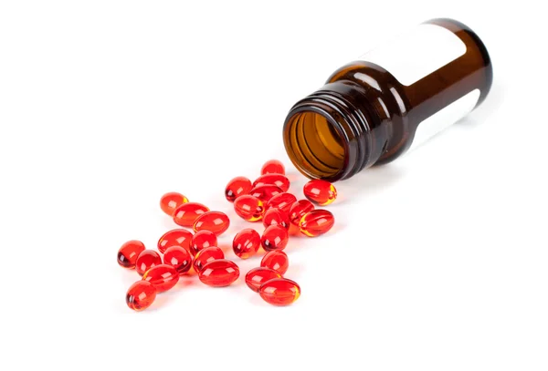 Red pills and the bottle Royalty Free Stock Images