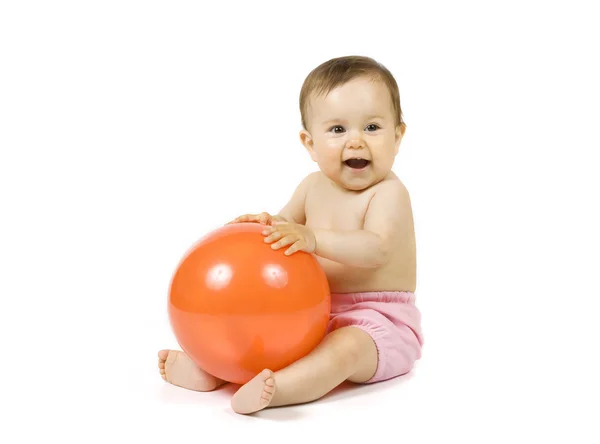 Baby with the orange ball — Stock Photo, Image