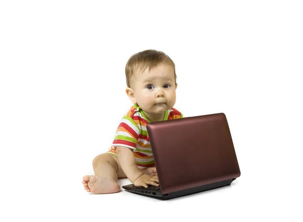 Stock image Baby with the laptop