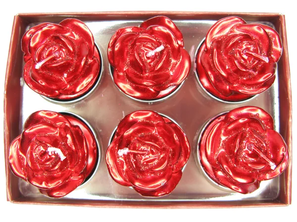 Velas vermelhas definir forma de flor rosa — Fotografia de Stock