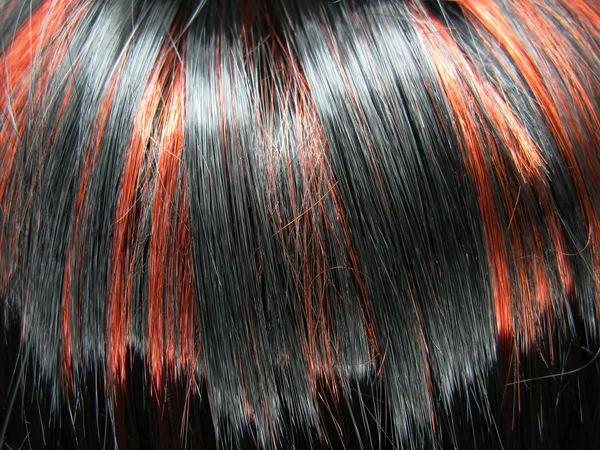 Black and red highlight hair texture background — Stockfoto