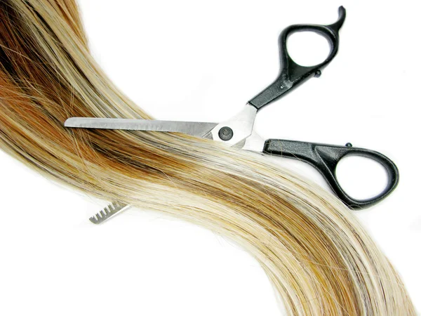 Hair brush and scissors in highlight hair — Stock Photo, Image