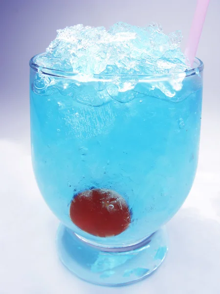 Alcoholic blue curacao liqueur cocktail with cherry — Stock Photo, Image