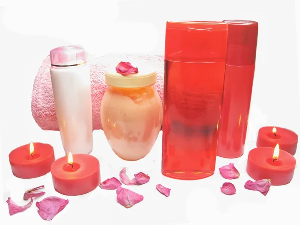 Spa rose petals cremes shampoo shower gel bottles — Stock Photo, Image