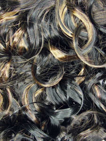 Curly mettre en évidence la texture des cheveux fond — Photo