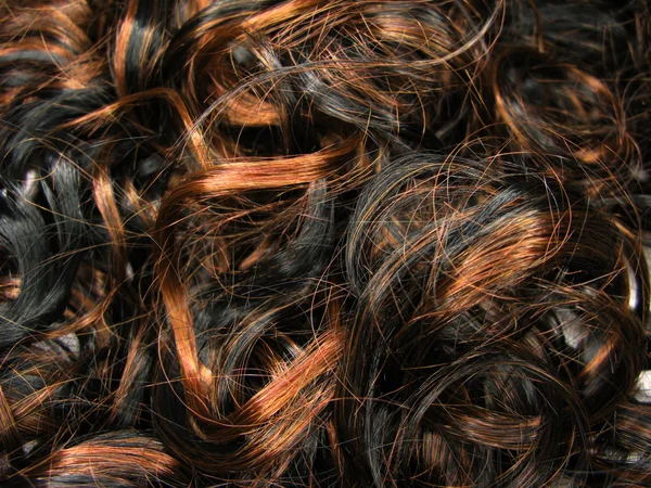 Kręcone czerwonego podkreślenia włosów tekstura tło — Zdjęcie stockowe