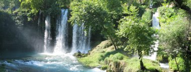 Waterfall duden out of grotto antalya turkey clipart