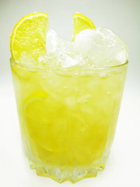 Yellow liqueur cocktail with lemon — Stock Photo, Image