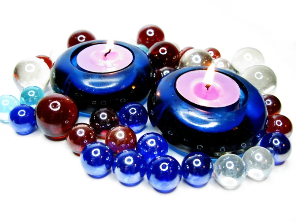 Spa candles among glass pebble — Stock Photo, Image