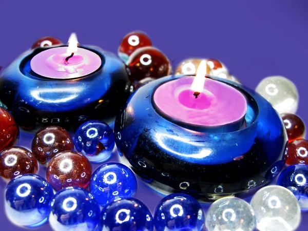 Spa candles among glass stones — Stock Photo, Image