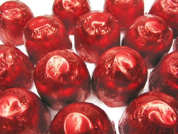 Słodycze w czerwony owijania — Zdjęcie stockowe