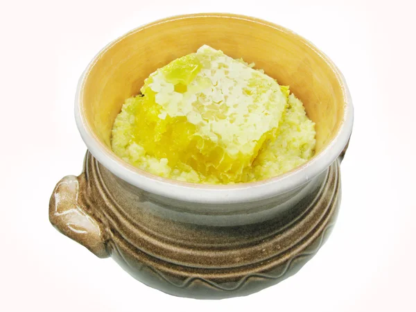 Porridge in clay pot with honey — Stock Photo, Image