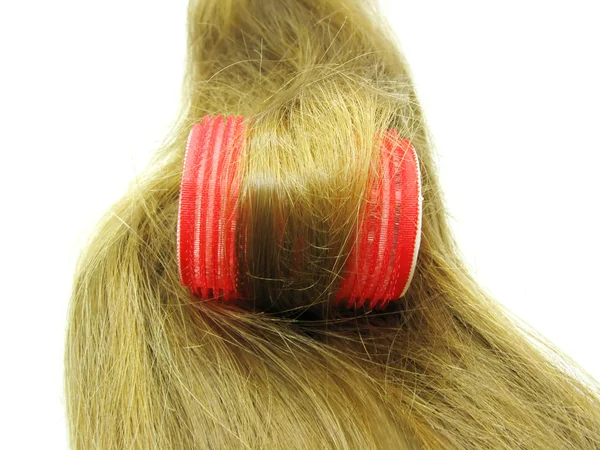 Rød hårrull i hårbølge – stockfoto