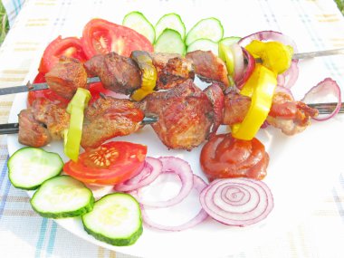 Griiled meat with vegetables barbecue outdoors clipart