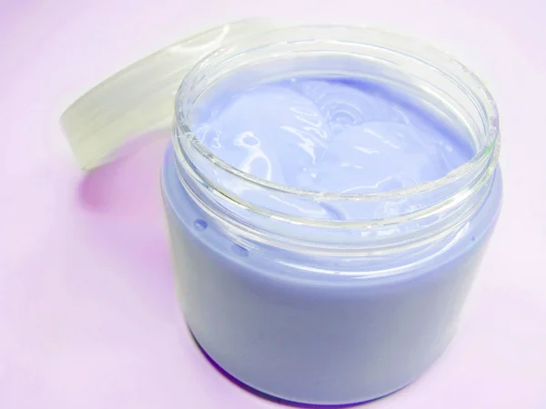 Violet cosmetic creme for face — Stock Photo, Image