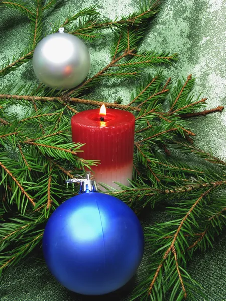 Red christmas balls and candle — Stock Photo, Image