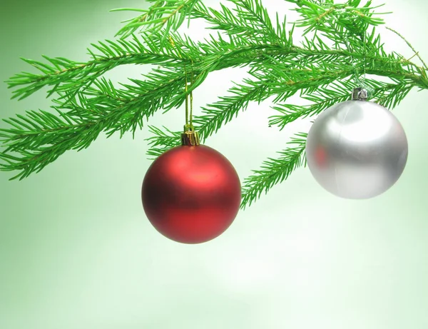 Christmas balls hanging on fir branch — Stock Photo, Image