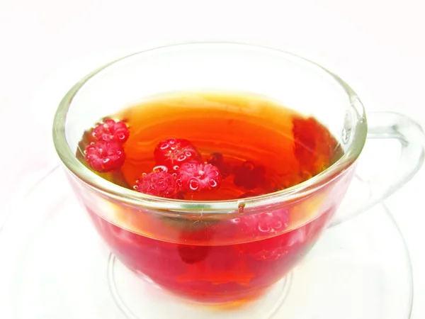 Fuit tea with raspberry in cup — Stock Photo, Image
