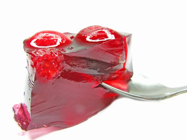 Marmelada de geleia vermelha com colher no interior — Fotografia de Stock