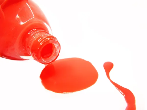 stock image Red pouring nail polisher