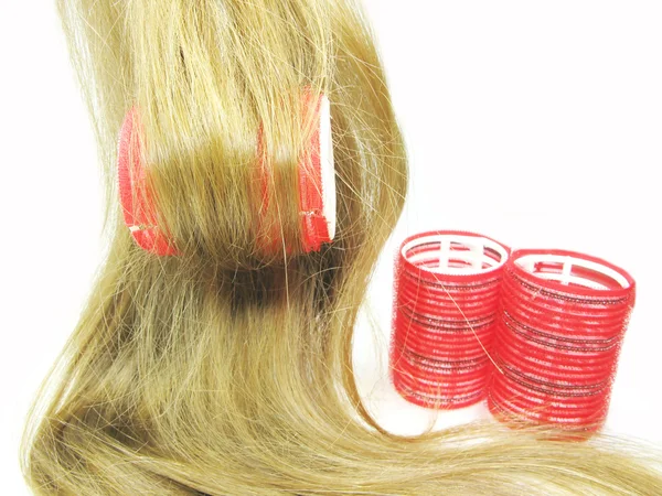 Rött hår roller i hår våg — Stockfoto