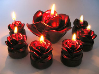 Rose spa scented candles set in darkness clipart