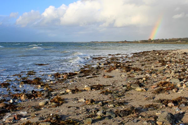 Rainbow over the coastline — Stock Photo, Image