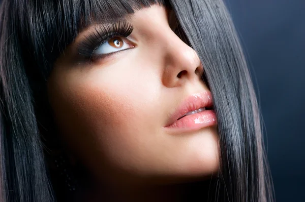 Fashion Brunette . Beautiful Makeup and Healthy Black Hair