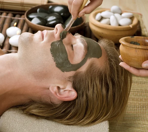 Spa. Handsome Man with a Mud Mask on his Face — Stock Photo, Image