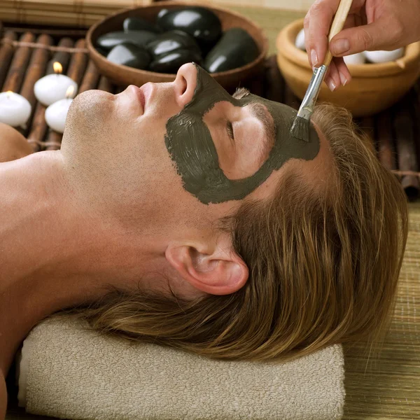 Spa. Handsome Man With A Mud Mask On His Face — Stock Photo, Image