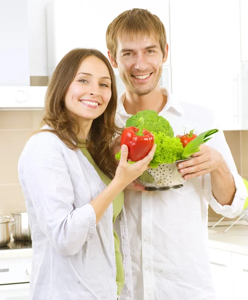 Young Couple Cooking Healthy food.Diet.Kitchen Stock Photo