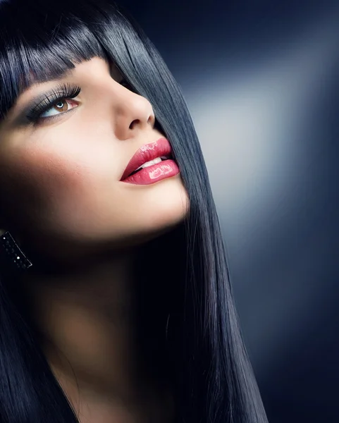 Fashion Brunette . Beautiful Makeup and Healthy Black Hair Stock Picture